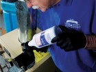 Applying boiler water treatment.
