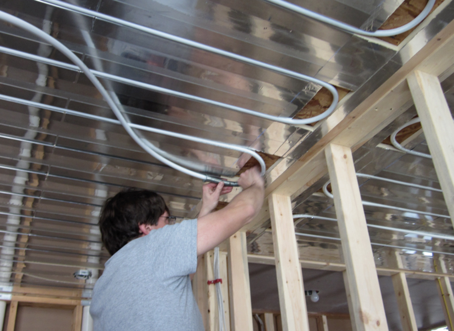 Figure 3 PEX-AL-PEX tubing being installed for radiant ceiling heating