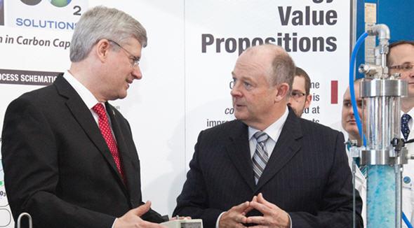 Prime Minister Stephen Harper and Christian Paradis, Minister of Industry and Minister of State (Agriculture), are given a tour of the CO2 Solutions Inc. facility by Glenn Kelly, president and CEO of CO2 Solutions Inc.