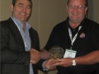 (Left) Marc Gendron, outgoing chairman of HRAI's contractors division and newly appointed chairman of HRAI board of directors, presents Peter Steffes with the Gerald Inch award for chapter leadership at HRAI's 45th annual general meeting, held from August 21 to 24 at the Westin Bayshore in Vancouver, BC.
