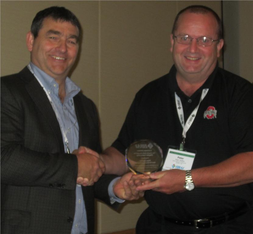 (Left) Marc Gendron, outgoing chairman of HRAI's contractors division and newly appointed chairman of HRAI board of directors, presents Peter Steffes with the Gerald Inch award for chapter leadership at HRAI's 45th annual general meeting, held from August 21 to 24 at the Westin Bayshore in Vancouver, BC.