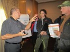 John Barba, trainer from Taco, answers questions about hydronic systems with attendees following his seminar.