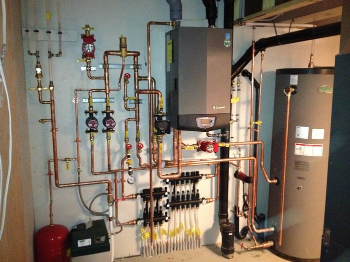 Whitehead submitted an entry detailing the installation of a Knight wall mount boiler and a Squire indirect water heater at a custom home in Calgary, AB (shown here).