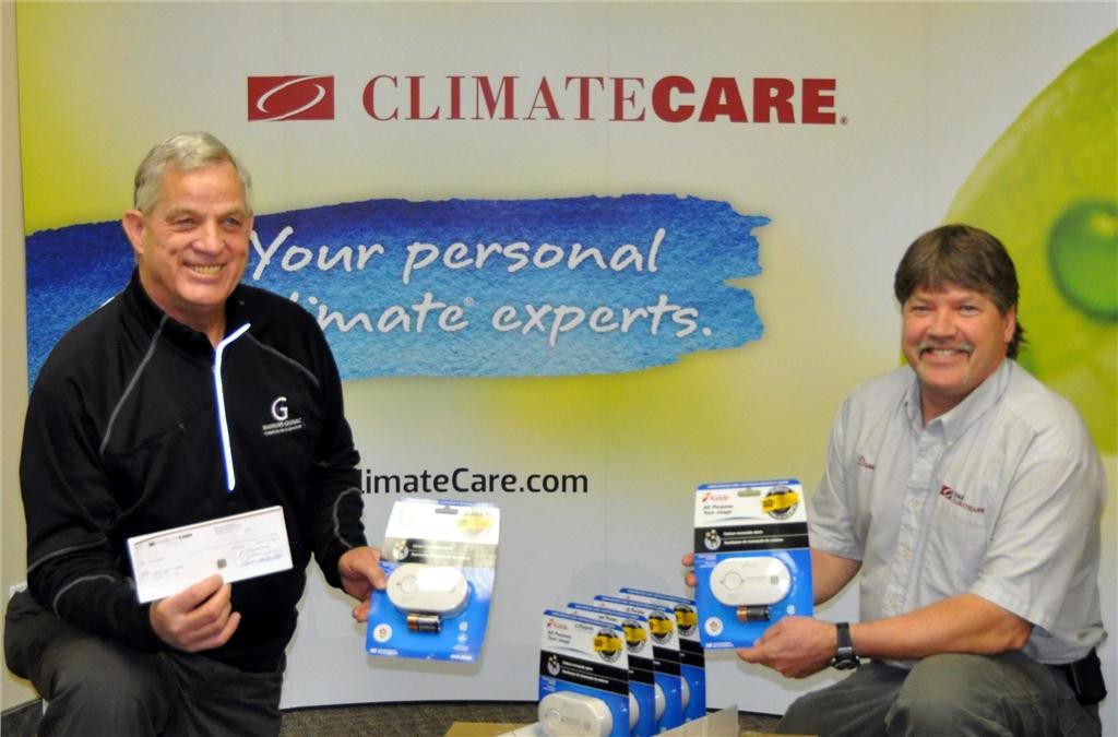 John Gignac (left) founder of the Hawkins-Gignac Foundation with ClimateCare past president Dave Murtland of D&B ClimateCare in Simcoe, ON.