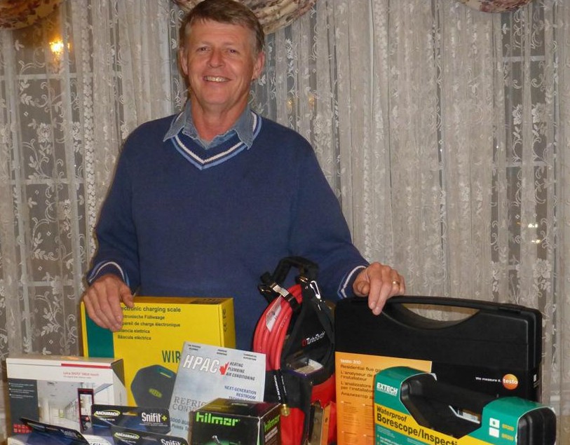 HPAC's Tremendous Tool Take-Away contest winner Gerry Myers of Myers Refrigeration Service in Stittsville, ON poses with his winnings, which included an inspection camera, distance meter, combustion analyzer, CO monitor, dual readout thermometer, portable torch kit and electronic charging scale.