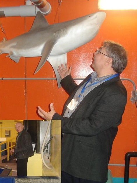 Attendees were treated to a "behind the scenes tour" of the attraction. Kevin O'Reilly points out a predator in the mechanical room, while Brian Pinnock (inset) of Victaulic takes note of an advancing giant sea turtle in the animal husbandry area.