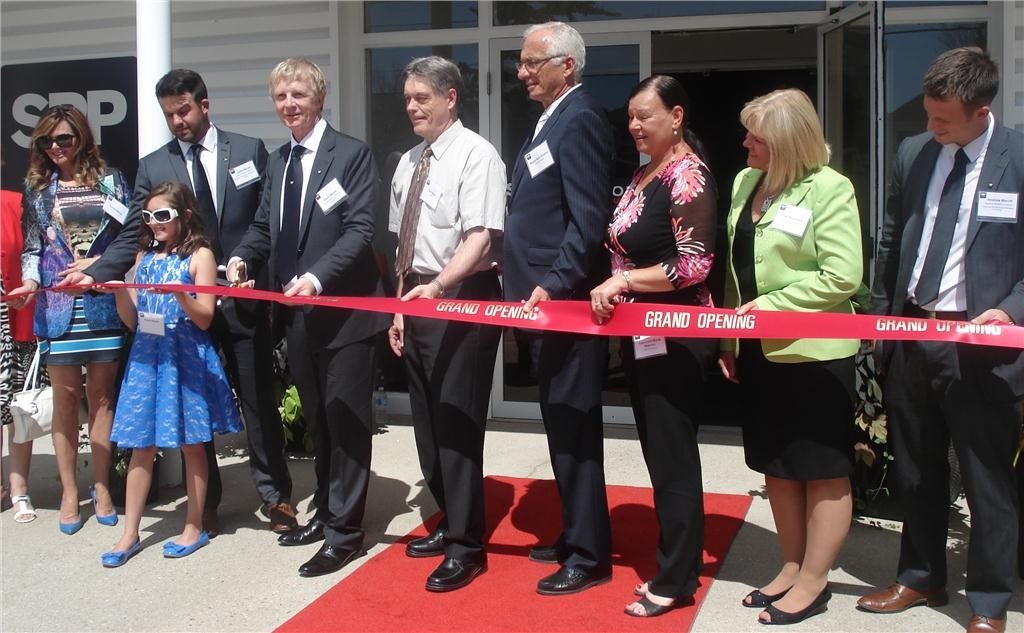 Superior Radiant Products president Kevin Merritt (fourth from left) with family and local officials at the ribbon cutting ceremony at 563 Barton Street in Stoney Creek, ON.
