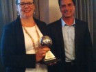 France Lemieux accepts the 2014 Joseph K. Seidner Award from Plumbing Industry Advisory Council chairman Kevin Ernst of OS&B.