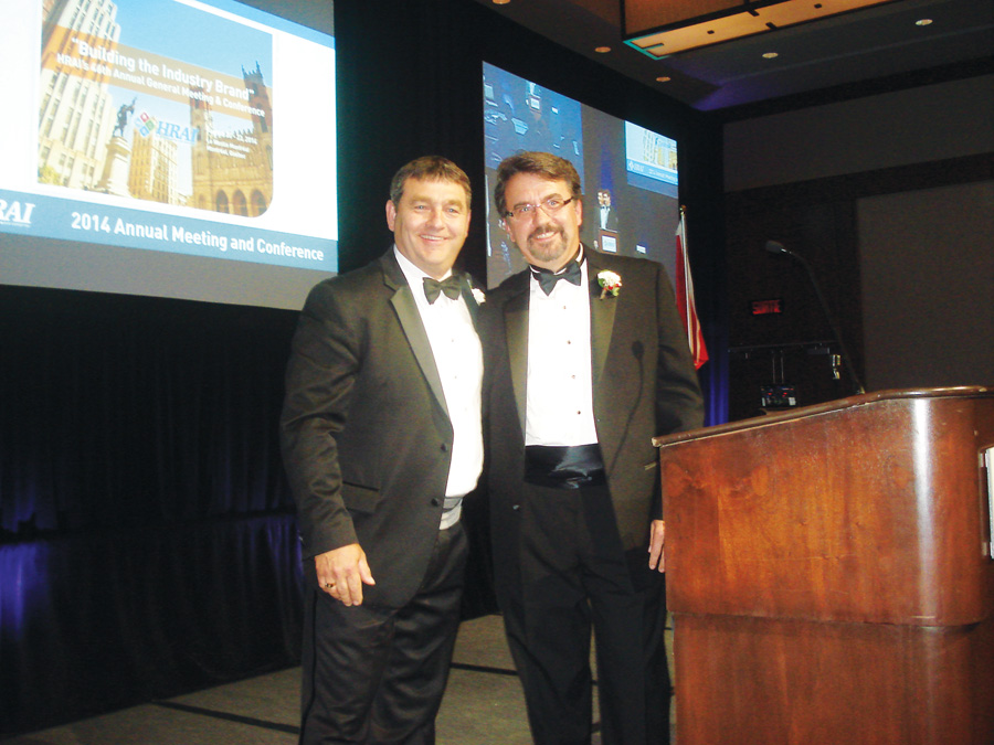 Jim Flowers (r) and Marc Gendron, 2013-2014 chairman, share a moment on stage during the Chairs' Banquet. Flowers, who is with Linde Canada, is HRAI's 2014-2015 chairman. He has served on the HRAI Board since 2012 as a representative of the manufacturer's division and as chairman of that division since 2012.