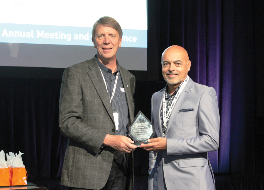 Warren Heeley, HRAI president and Jacques Brodeur (r) of Natural Resources Canada, Ottawa, ON, one of four recipients of the President's Recognition Award. Brodeur was instrumental in organizing the NRCan subsidies for SkillTech Academy participants.