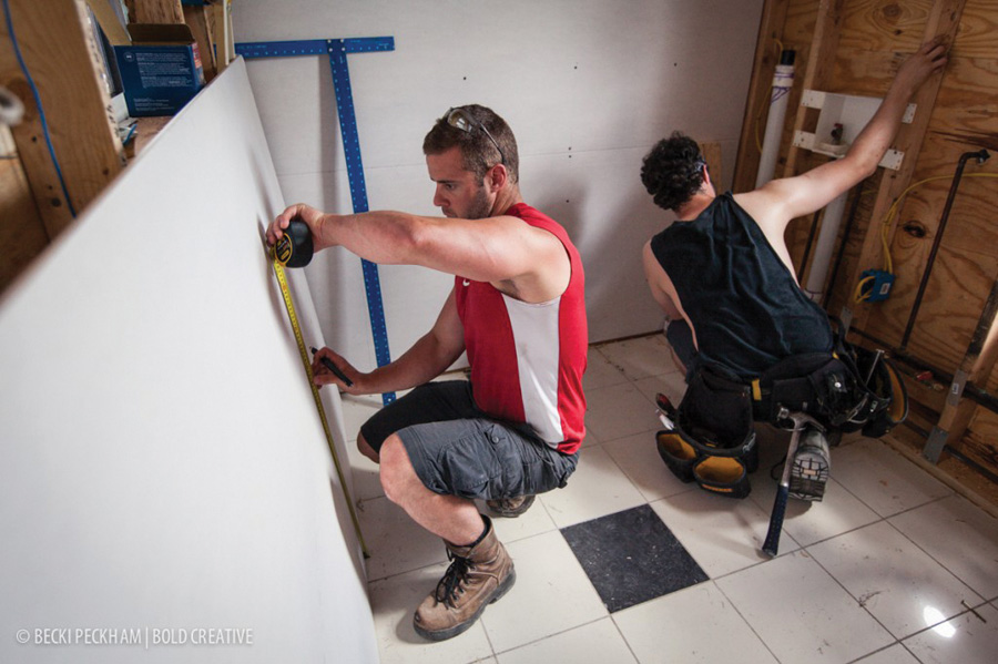 Mark Fagan (l) and Dave Mandville size up their work at the Annuciation Mission.