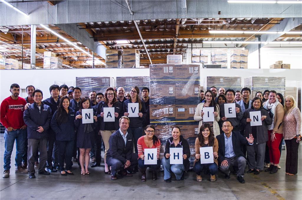 Navien team members celebrate shipment of NHB series.