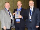 Michael Brunt of Flexmaster is presented with a New Member Plaque by Dennis Costello, CIPH ON Region president (l) and Paul McDonald (r), CIPH chairman.