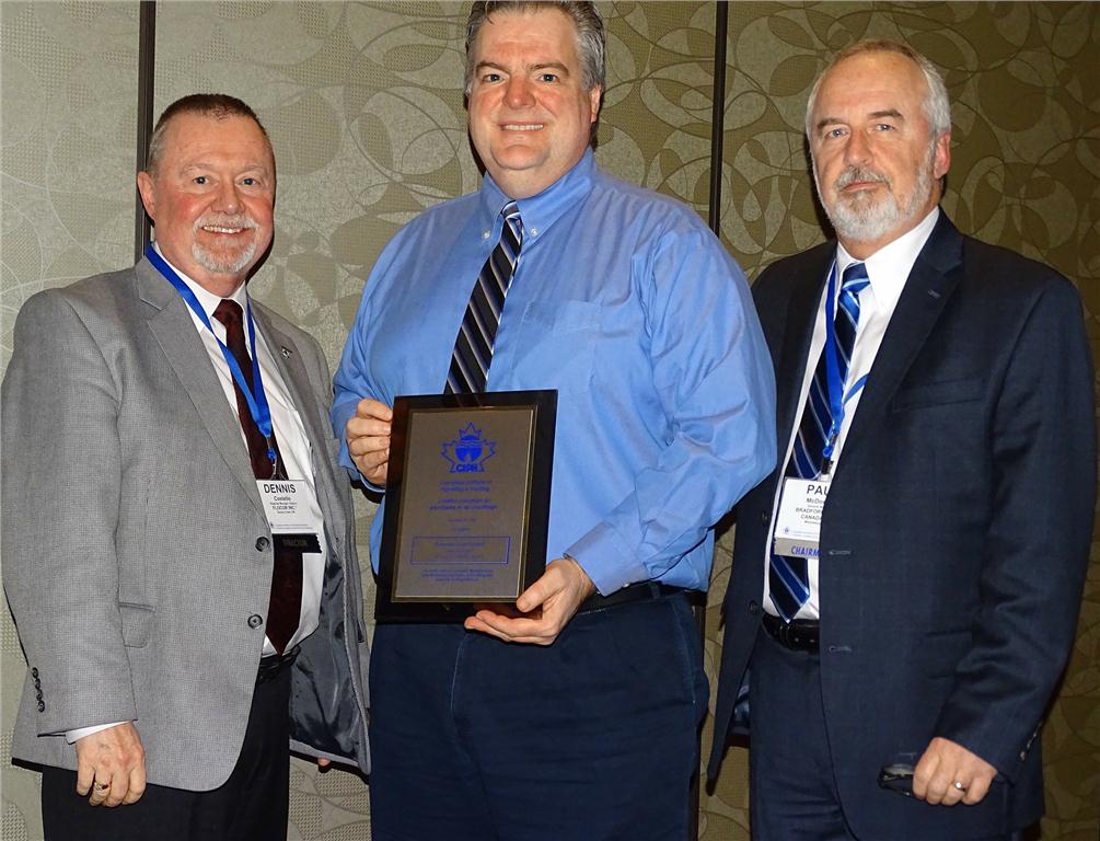 Kevin Berriman of Emerson Swan accepts a New Member Plaque from Dennis Costello, CIPH ON Region president (l) and Paul McDonald (r), CIPH chairman.