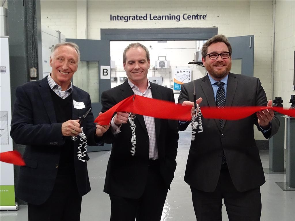 Lawrence Barrett, president "emeritus" standing in for John Rhodes who was unable to attend, Ryan Garrah, general manager and Brantford Mayor Chris Friel officially open the expanded emerson Climate Technologies Integrated Learning Centre.