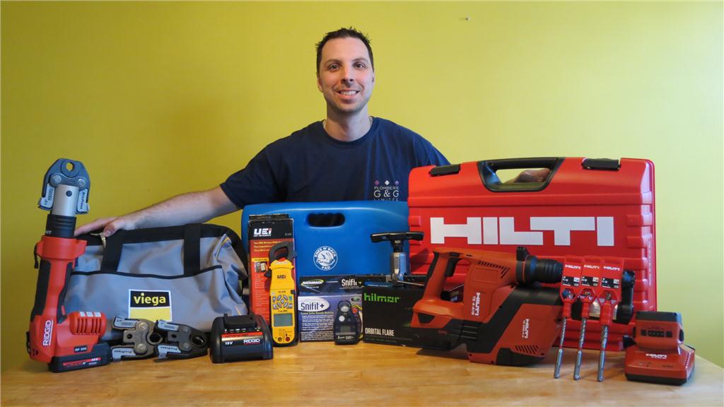 Benoit De Gagn-Marcouillier, of Plomberie G&G Limitee in Montreal, is shown here with his Great Tool Takeaway (Raflez les outils) winnings.