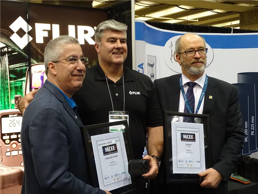 President and general manager of CIPH (l) and Andr Bergeron, CMMTQ director general (r), present Flir Systems Canada general manager Greg Bork with the Product of the Year and Tools awards for its thermal imaging system at MCEE 2015.