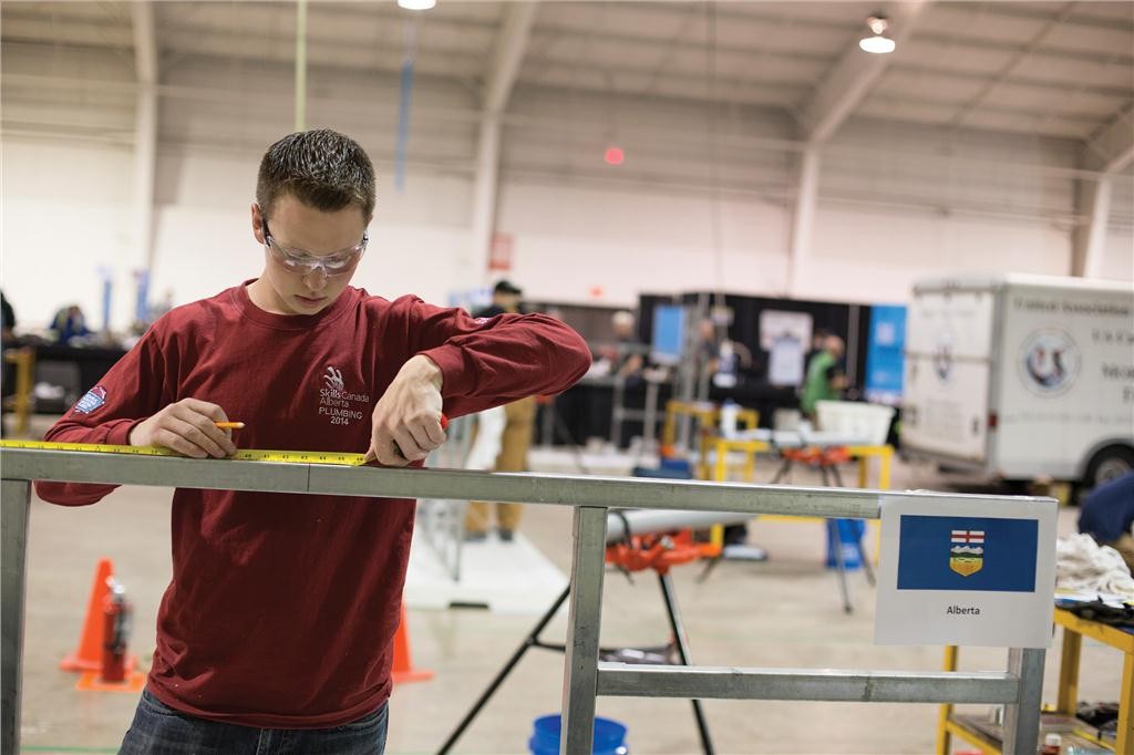 Monarch, AB native Ken Howe takes his measurements during the plumbing and heating competition at the national competition in 2014. He will be sticking to that strategy at WorldSkills. Photo Skills Canada Alberta