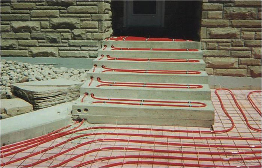 Tubing fastened to concrete stairs and insulation before an overpour.
