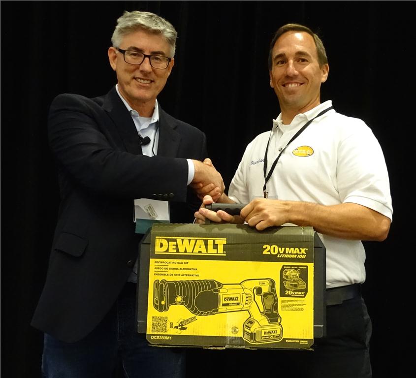 The DeWalt 20V MAX Lithium Ion Reciprocating Saw was won by Brendon Aldridge, shown here with Robert Bean(l).