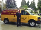 Paul Myers stands beside his company van outside of Lions Gate Hospital. Photo Lions Gate Hospital Foundation.