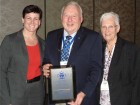 Eric Todd of Bardon Supplies proudly displays his 50 Year Service Award with CIPH chair Sin Smith and his wife, Judy Todd (r) by his side.