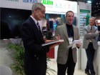 John Siegenthaler (c) at his book launch at AHR where he announced that he was dedicating his book, Heating with Renewable Energy, to Bob (Hot Rod) Rohr (l). Mark Olson, chief executive officer and general manager at Caleffi North America, Inc., looks on.