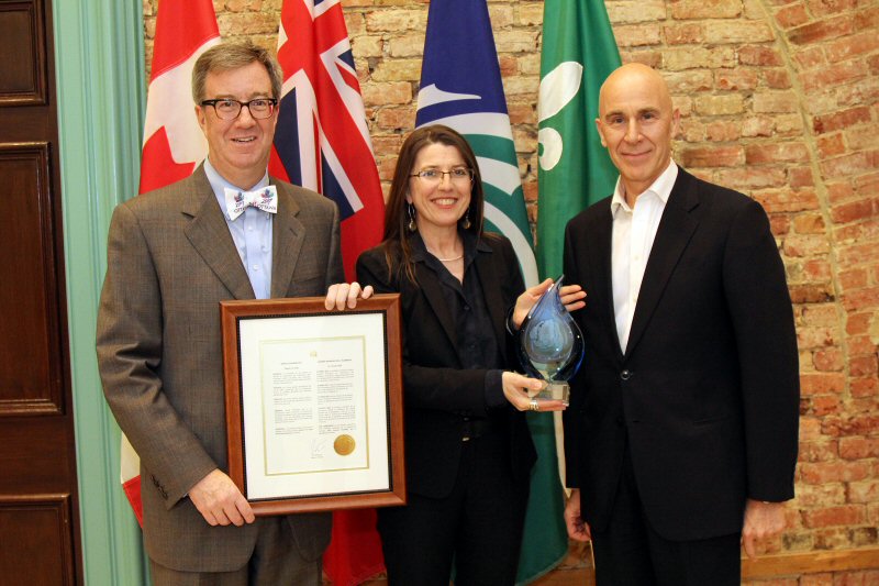 Ottawa Mayor Jim Watson (l) shows off the official proclamation for World Plumbing Day, which was celebrated this year with the first National Water Wise Award presented to Nicole Hurtubise, CEO of WaterAid Canada by Claude Des Rosiers (r) on behalf of CIPH.
