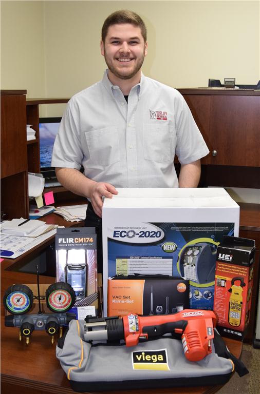 Ryan Moniz of Quality Mechanical Inc. in Mississauga, ON with his Tremendous Tool Take-Away winnings.